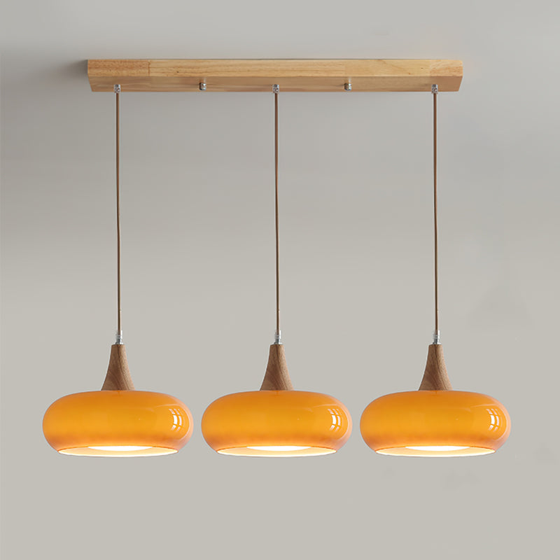 Modern Amber Glass And Round Wood Accent Pendant Light With Metal Frame