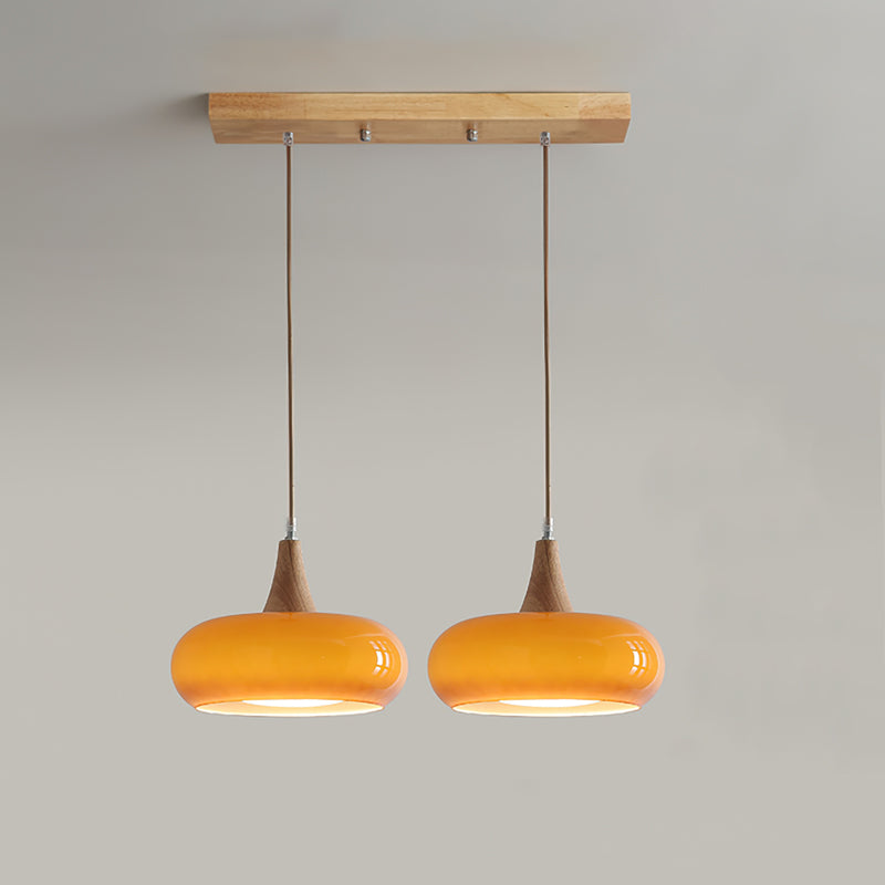 Modern Amber Glass And Round Wood Accent Pendant Light With Metal Frame