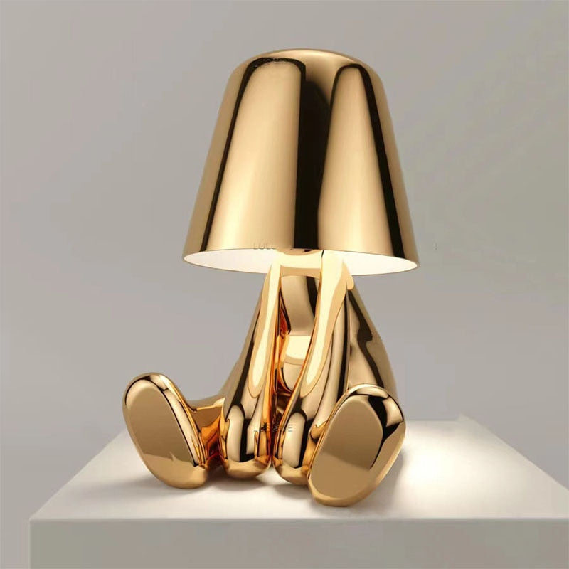 Reflective Metallic Table Lamp With Sculptural Seated Base And Dome Shade