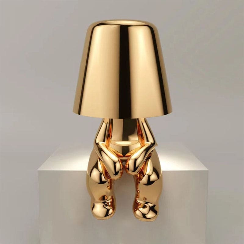 Reflective Metallic Table Lamp With Sculptural Seated Base And Dome Shade