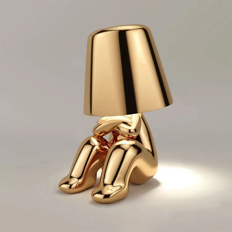 Reflective Metallic Table Lamp With Sculptural Seated Base And Dome Shade