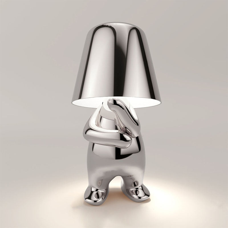 Reflective Metallic Table Lamp With Sculptural Seated Base And Dome Shade